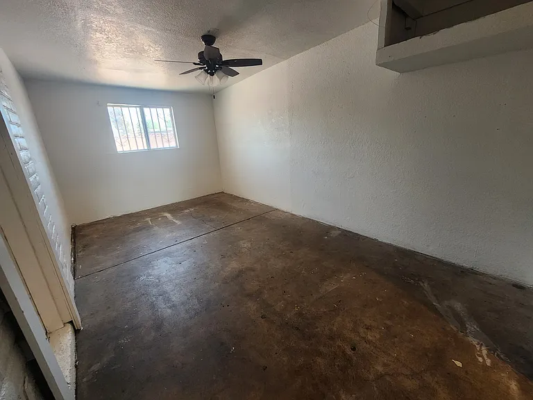 extra room, needs flooring. is part of the converted carport