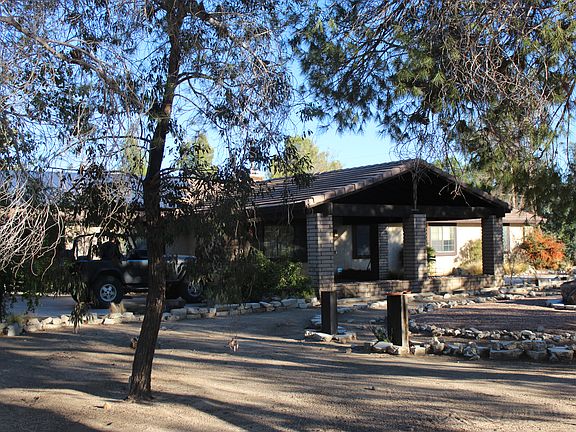 Front yard and vehicle overhang.