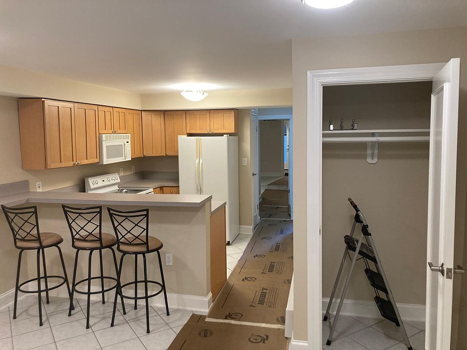 Living room/kitchen/closet view from front entrance