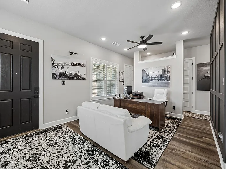 Open office/ sitting area with large windows allowing for fresh air breezes and natural light