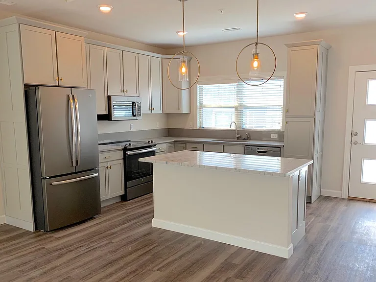 The Pismo- Spacious Kitchen at front of Villa w/Large Center Island That Opens Out to the Dining and Great Room Living Area