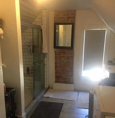Second Level - Oversized shower with bench. Laundry room.