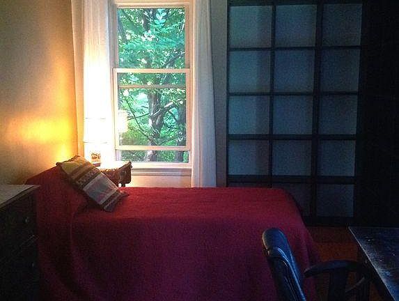 Rear bedroom with lots of afternoon sun. Double bed/dresser included if desired. Curtains or blinds included in all rooms except kitchen. Bookshelves not included.