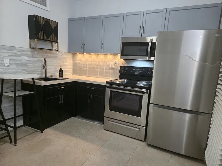 Brand new refrigerator and movable island.