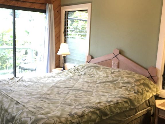 Master bedroom has balcony with sunset views