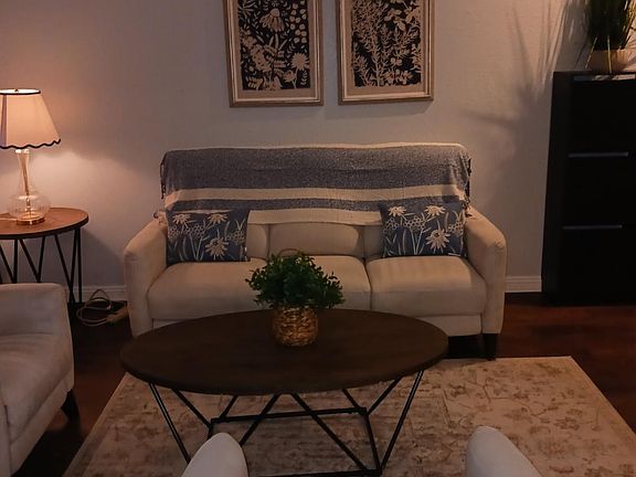 Living room with throw pillows and accent throw added