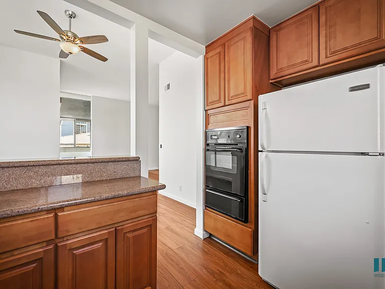 Kitchen with Refrigerator, Stove, and Ample Cabinet Storage