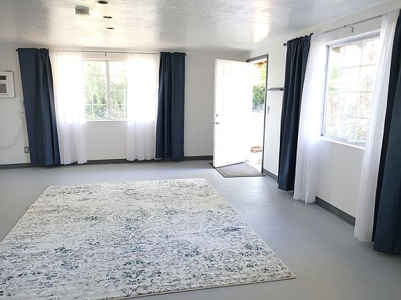 This is a view of b oth large picture windows in Studio A. You see the air conditioner on the wall. It functions perfectly and keeps the room very, very cool. It is two years old and rarely used except when exceptionally hot.