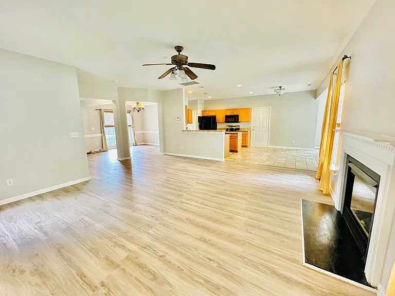 Open floorplan that unites the living room into the kitchen and sunroom