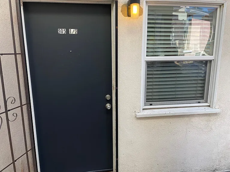 Freshly painted front door. This unit generously boasts natural light from multiple windows throughout!