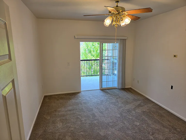 private balcony off the primary bedroom also provides access to the hot water heater and furnace