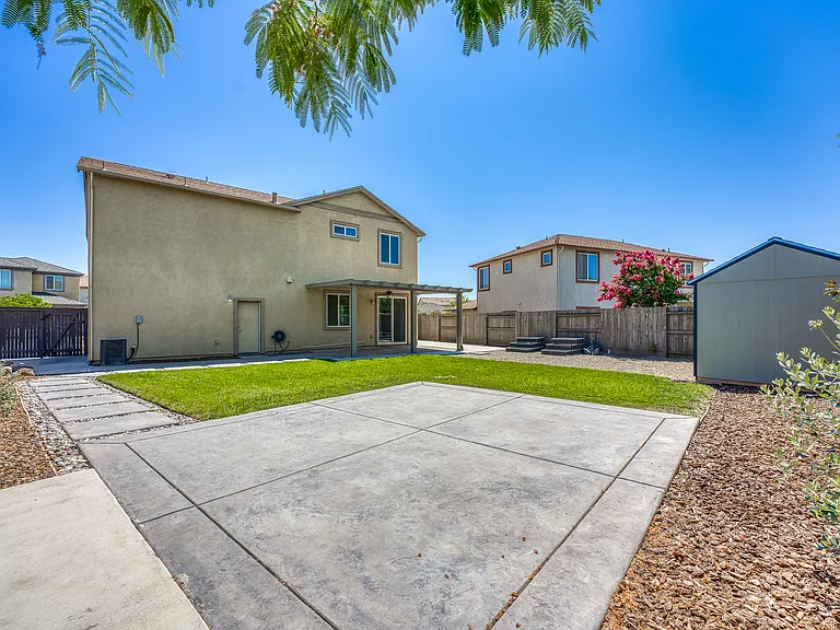 Huge backyard! Second uncovered stamp patio and walkway.