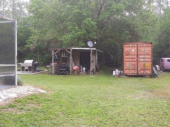 Shipping container and shed