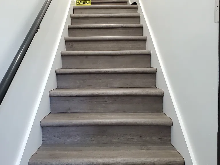 All new flooring going upstairs from front door to unit.