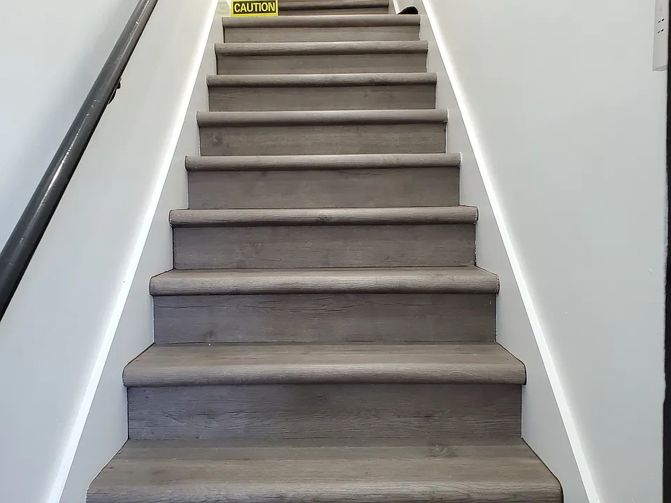 All new flooring going upstairs from front door to unit.