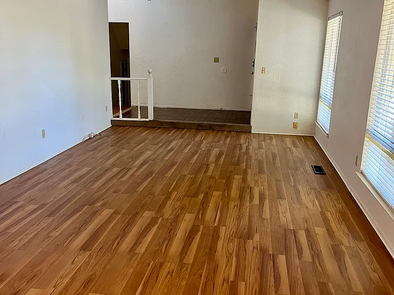 Living and dining rooms, entrance, and hallway.