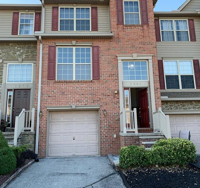 Front of the house. Beautiful driveway with garage.