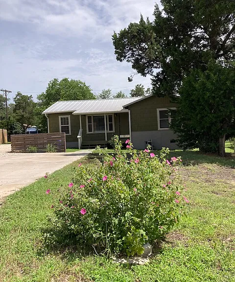 front of house with rock rose