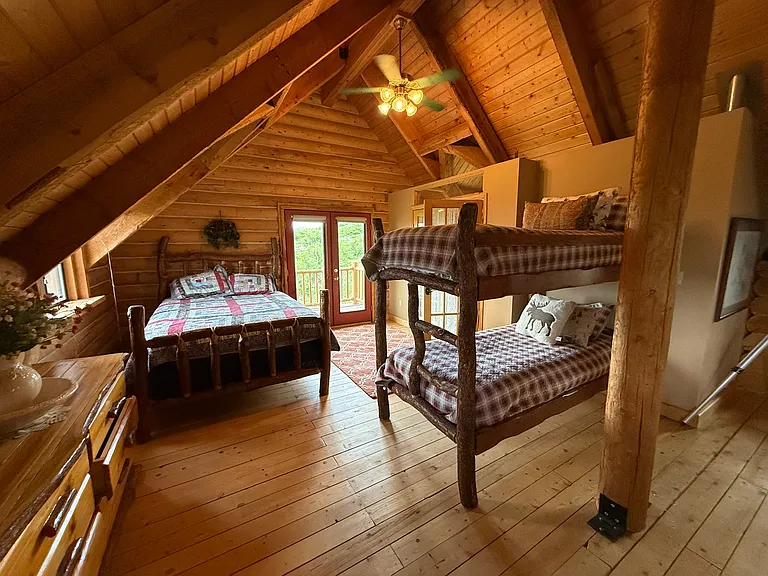 Top floor east sleeping area: queen bed and bunkbeds