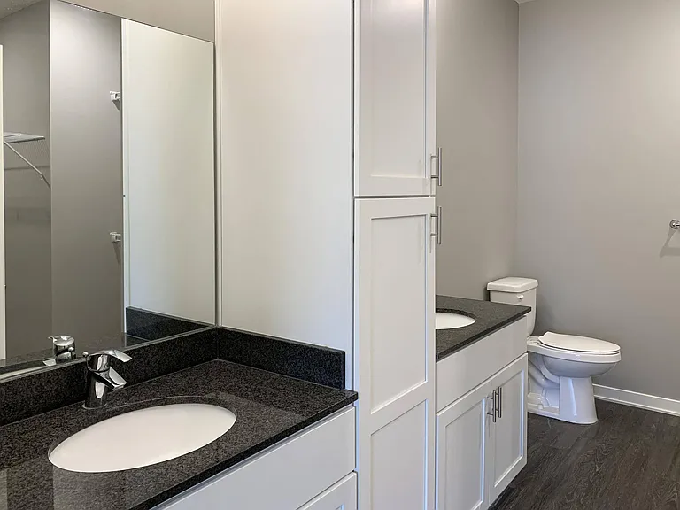 Our bathrooms include spacious vanities with ample storage, perfect for keeping your essentials organized.