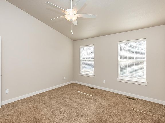 Master bedroom with vaulted ceiling