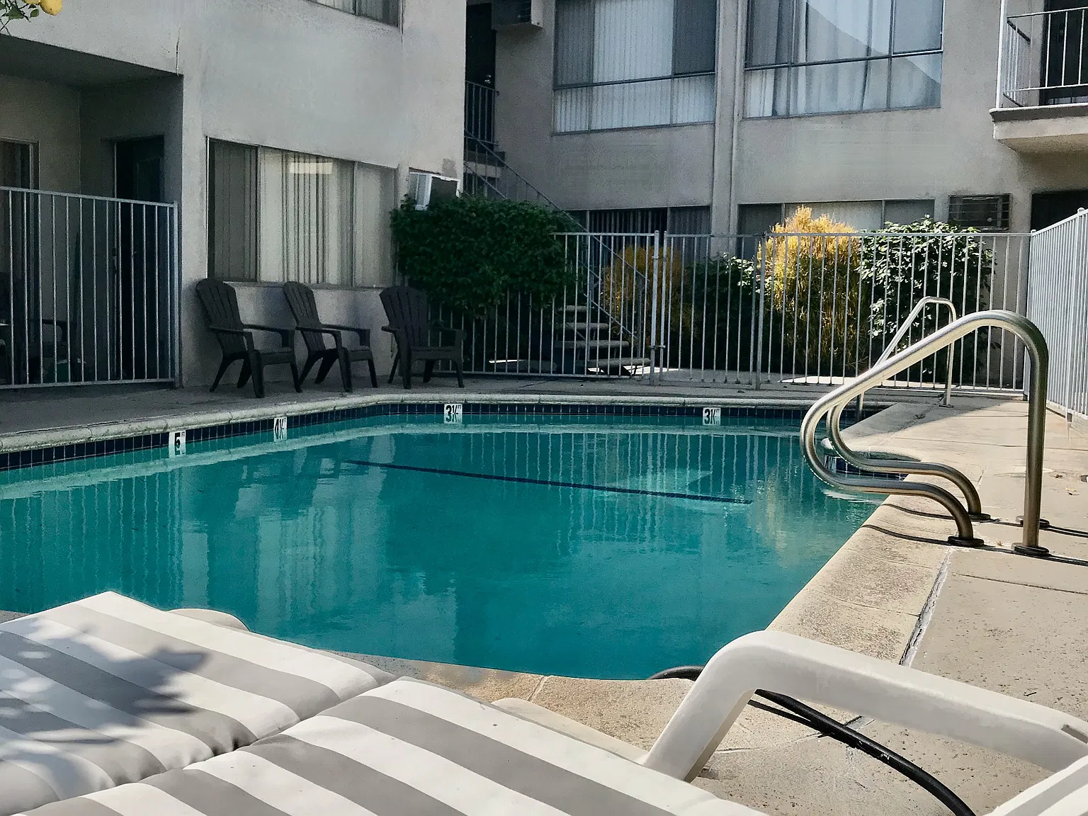 Gated Pool~ Only 11 Units on Condo Style Pristine Property ~ Laundry, Manager & Parking on premises