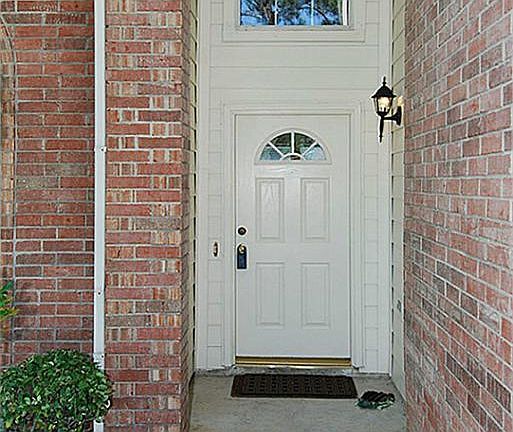 Arched windows in door and windows let in loads of light