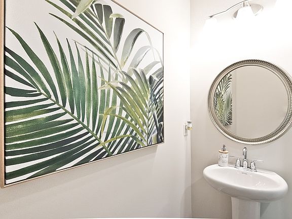 Powder room on the main level is easily accessible.