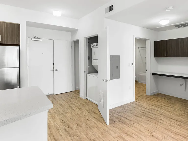Kitchen with Stainless Steel Appliances and In-home Washer and Dryer