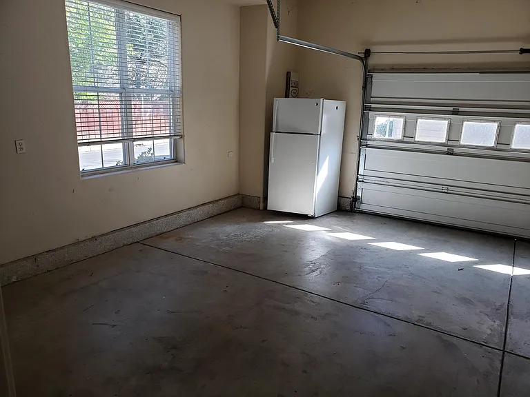 2.5 car garage with additional refrigerator/freezer.