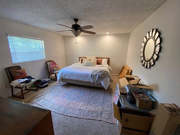 Very Large Master bedroom with recessed ceiling lighting and ceiling fan with light.