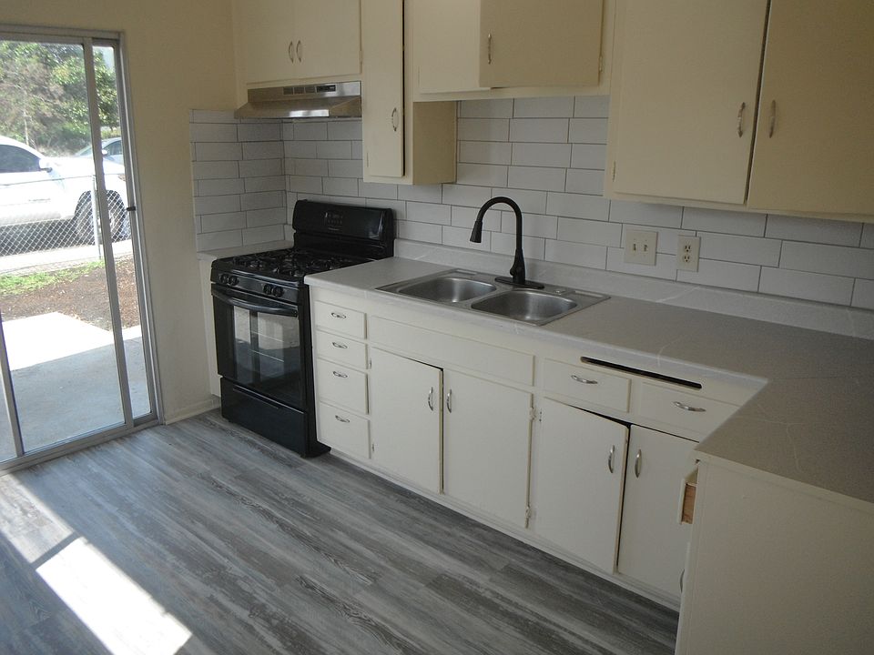 Kitchen with sliding door to patio & yard