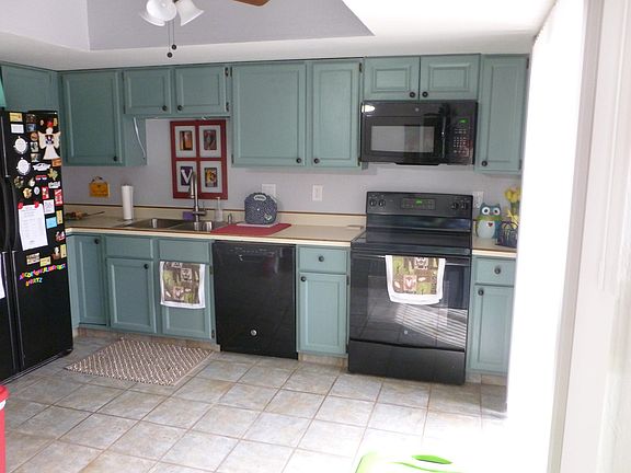 Kitchen with tile floors new appliances micro-wave, large pantry and large fridge. Fully stocked W/ appliances
