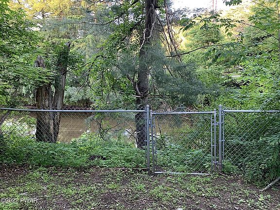 fenced back yard & creek 