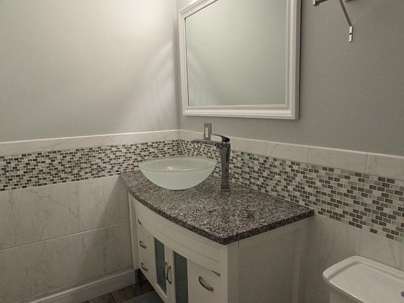 Totally updated bath w/granite & ceramic tile