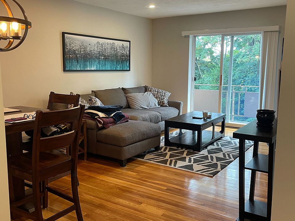 View from the hallway of the dining room and living room.