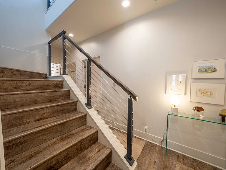 Two bedrooms downstairs, with the main living area and primary suite upstairs