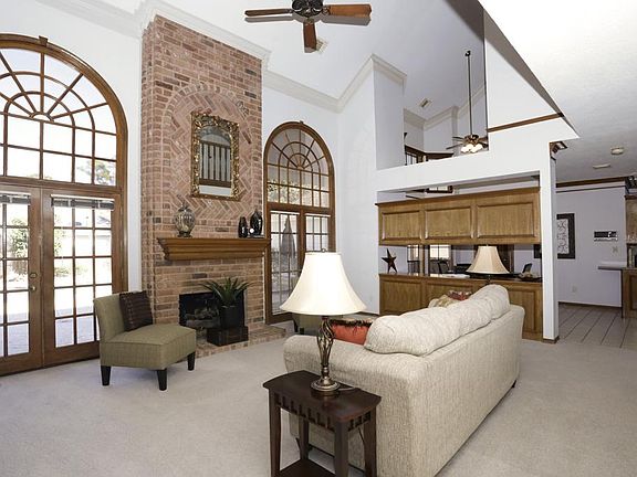 Spacious family room has lofty ceiling and flows to large breakfast area and updated kitchen.