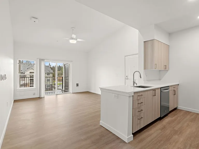 Savor the allure of vaulted ceilings and abundant natural light streaming in from the picturesque surroundings of Lacey.