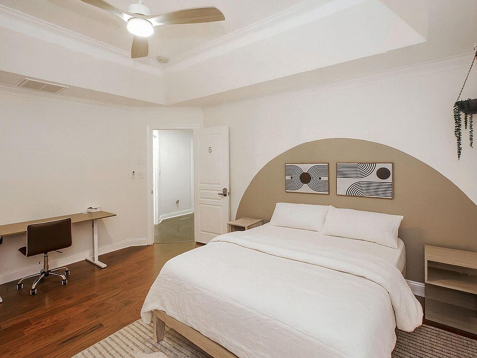 Master Room with a brand new smart TV, mini 2-door fridge, electric standing desk, quiet fan and a huge walking closet.