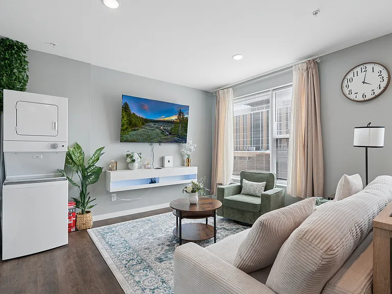 Spacious living area with natural light and a clean, modern aesthetic