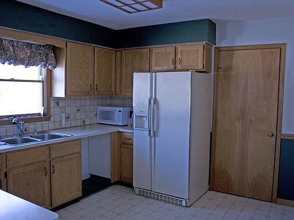 Kitchen leading to Laundry Room & Garage