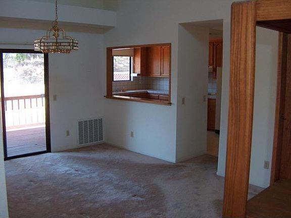 Looking through dining room to kitchen