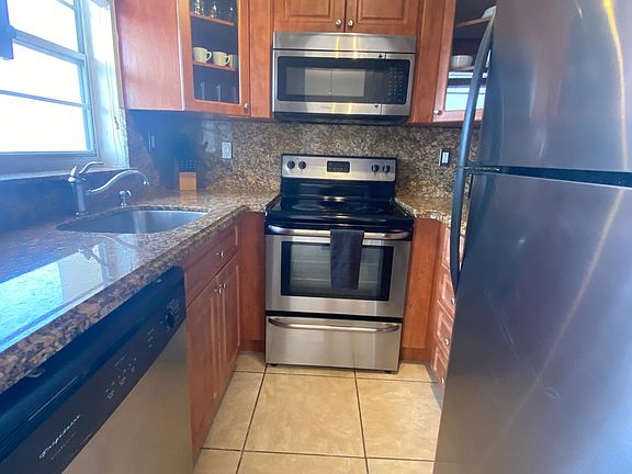 Alley Kitchen with Stainless Steel Appliances