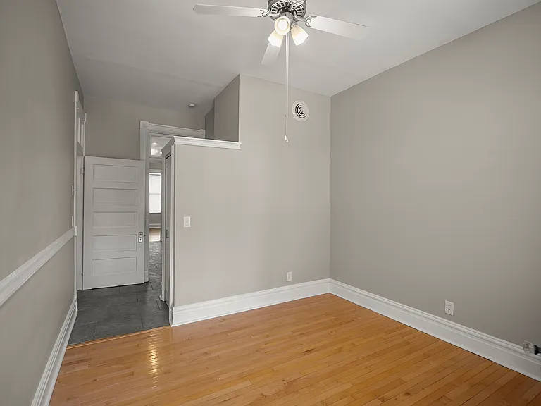 Another closet separates the bedroom from the bathroom hall and kitchen