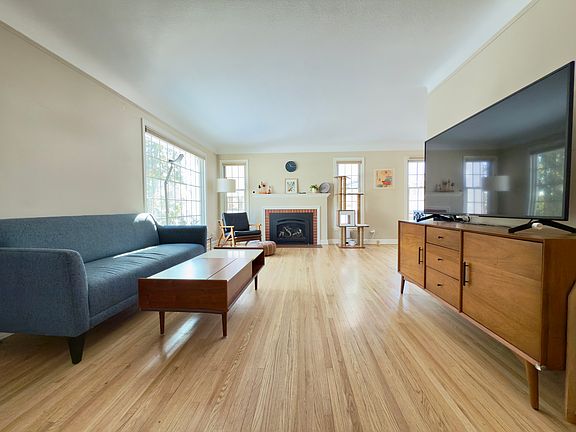 living room with ample light and newly added gas insert fireplace