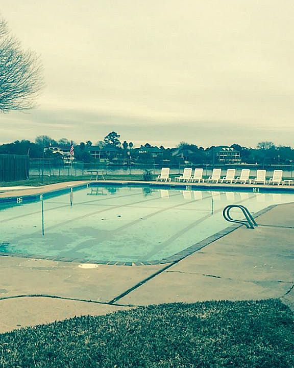 Neighborhood offers lakeside pool.