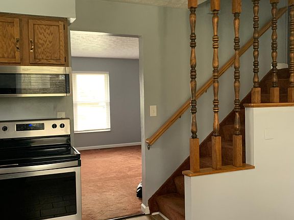 These steps lead to the upstairs where there are two bedrooms, more closet space, and a newly remodeled bathroom.