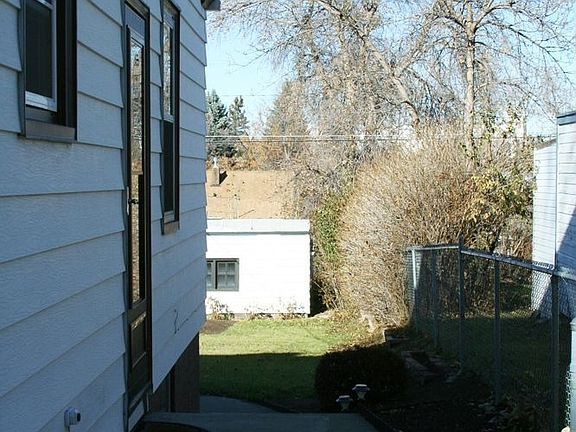 Side entrance with new entrance screen door and inside door