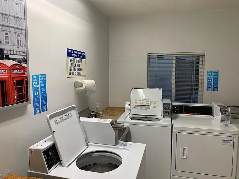 Woodbridge laundry room with coin or app operated washers & dryers